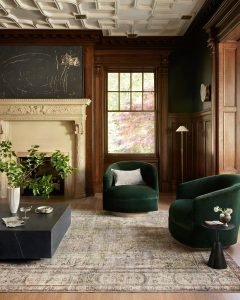 elegant living room in calming green with eclectic furniture