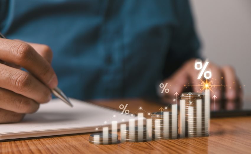 A businessman is calculating income and return on investment in percentage.